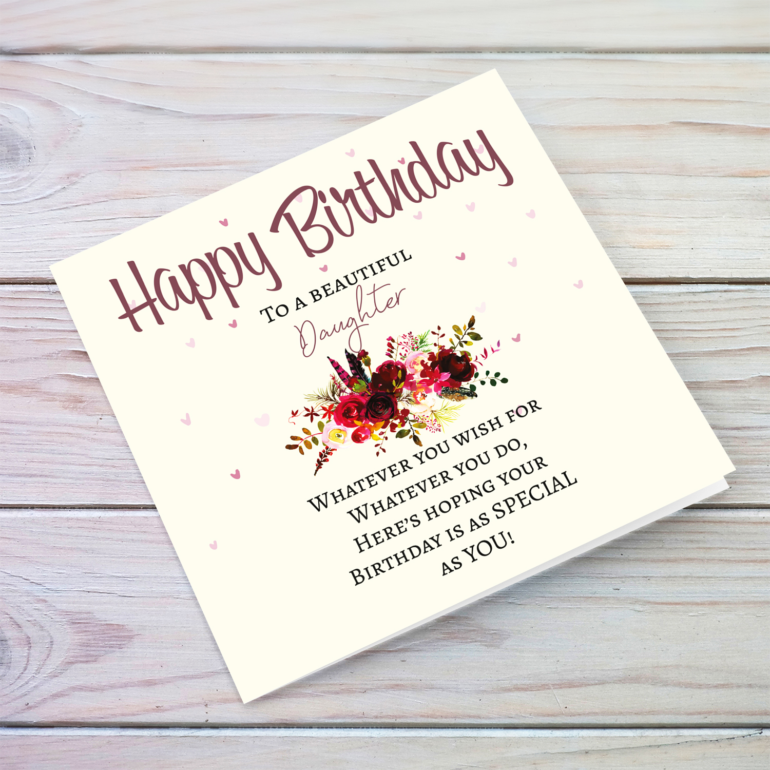 A birthday card with a special message with red tones colours and scattered hearts for a beautiful daughter in English