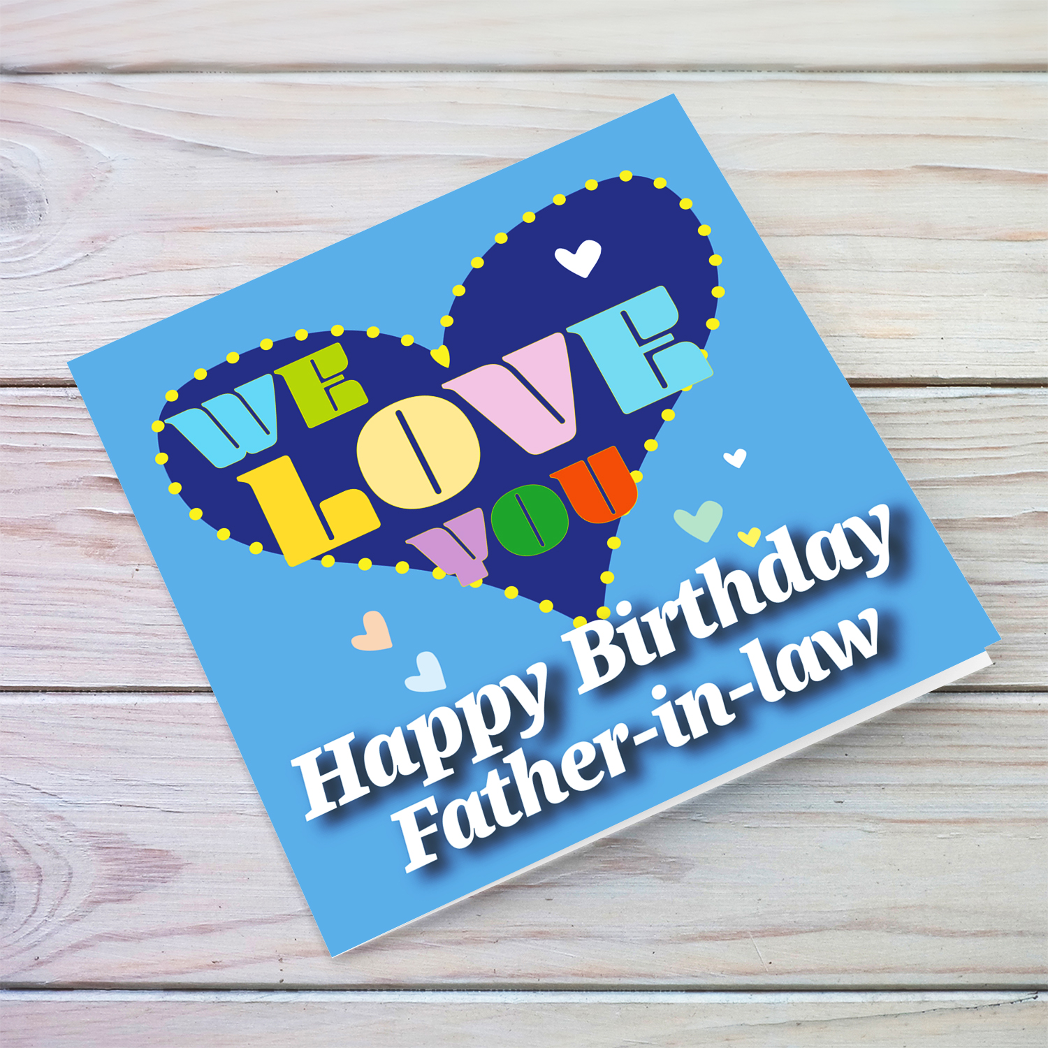 Blue background birthday card with big blue heart for father-in-law, with a big WE LOVE YOU and scattered hearts in English