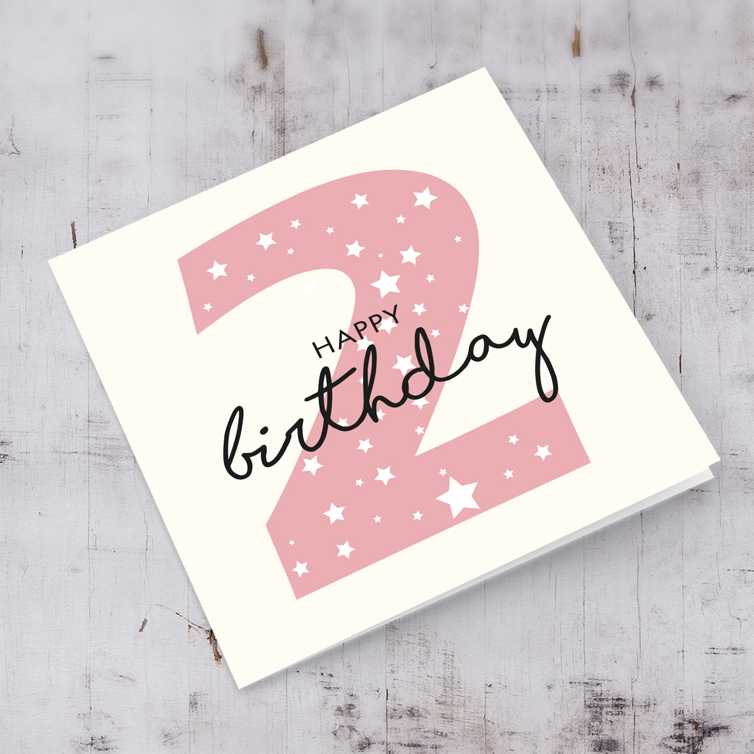 Pink number 2 with scattered white hearts birthday card in English