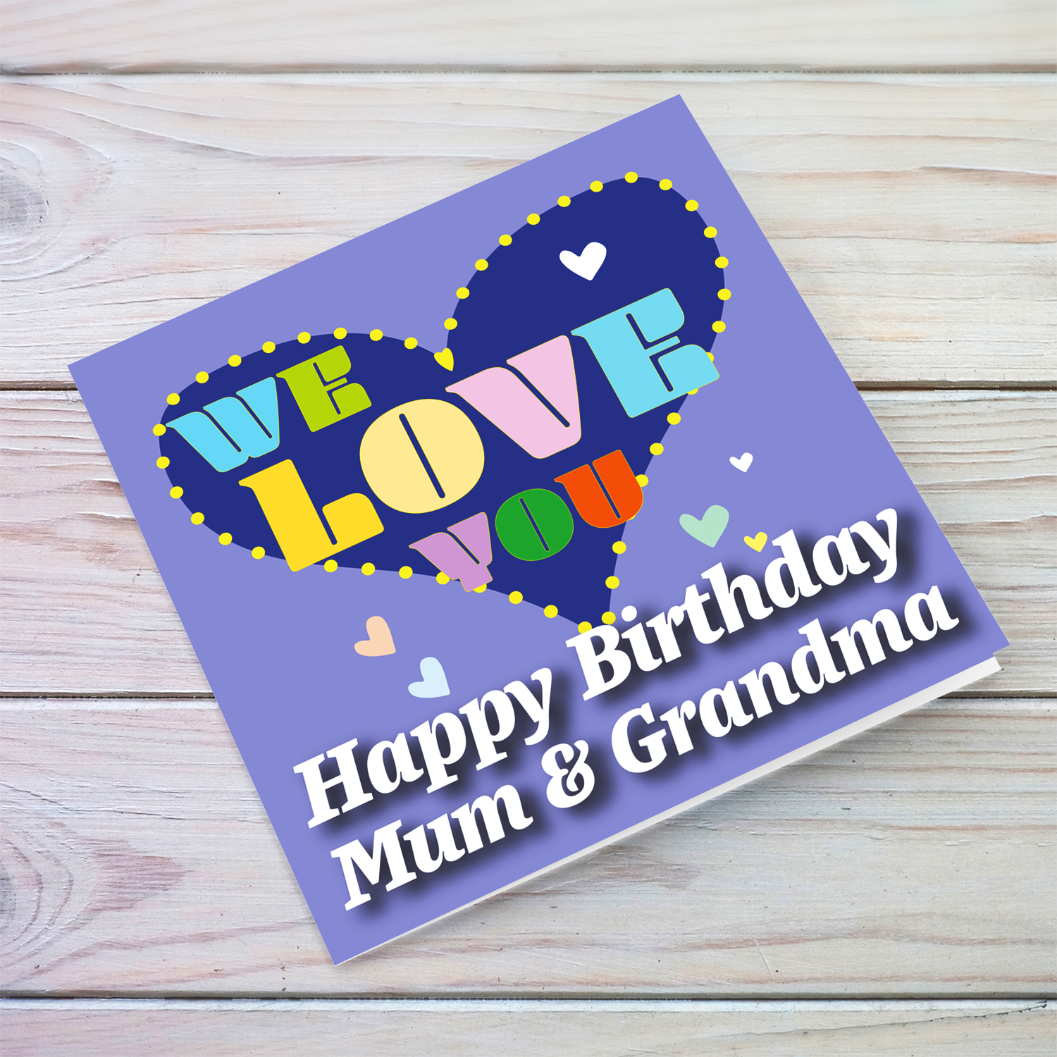 Purple background birthday card with big blue heart for mum & grandma, with a big WE LOVE YOU and scattered hearts in English