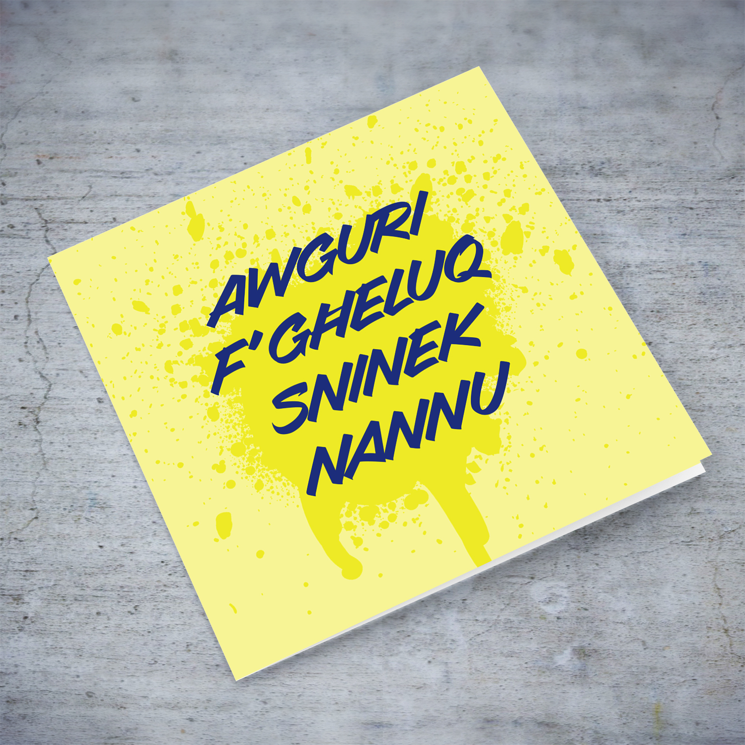 Yellow splattered paint background with blue text birthday card for grandpa in Maltese