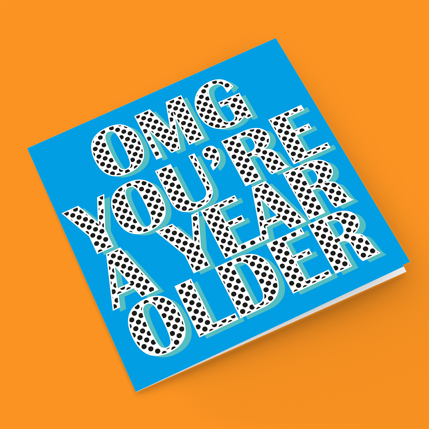 Blue background with polka dot wording you're a year older birthday card in English