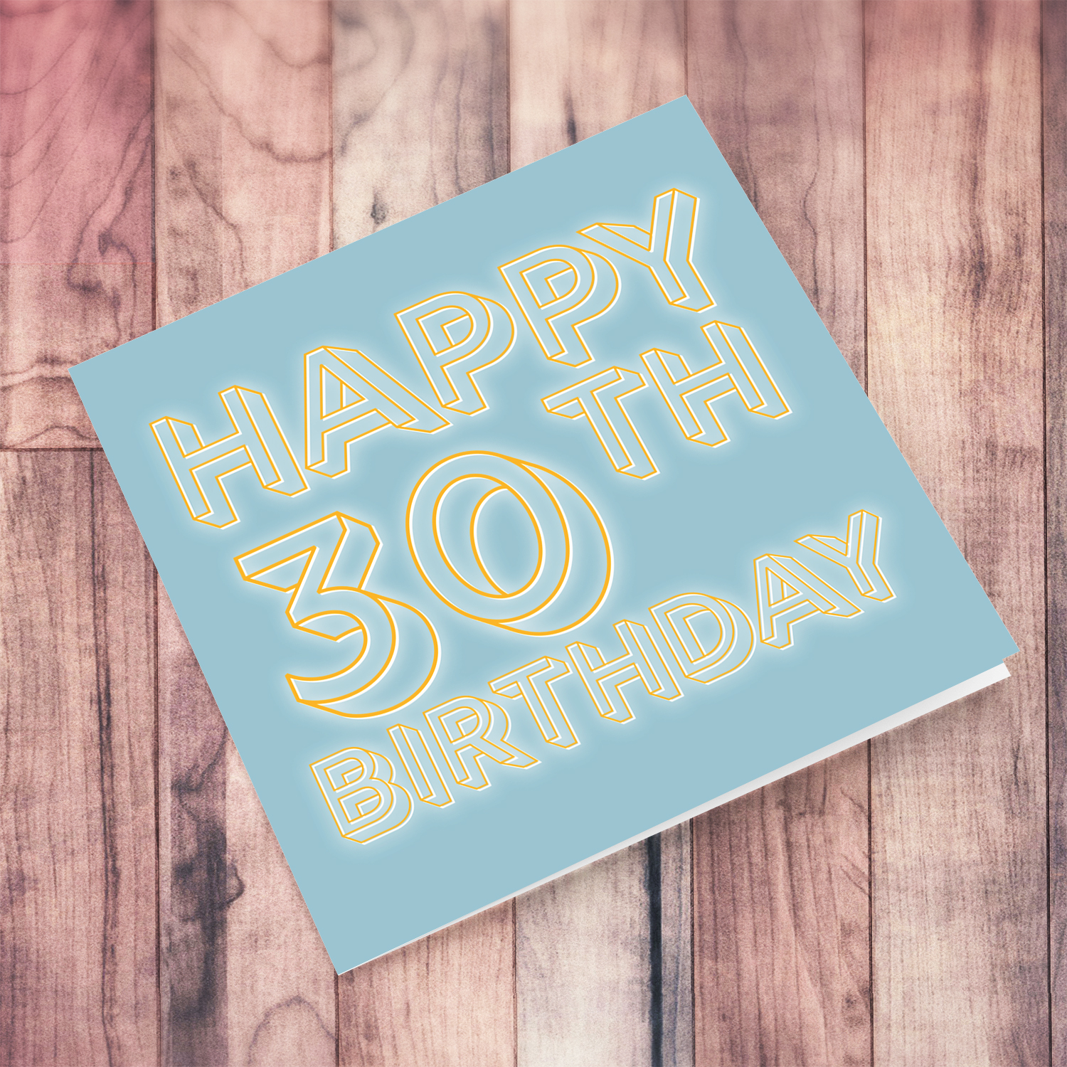 30th Birthday card with blue/grayish background and orange text with a white glow in English