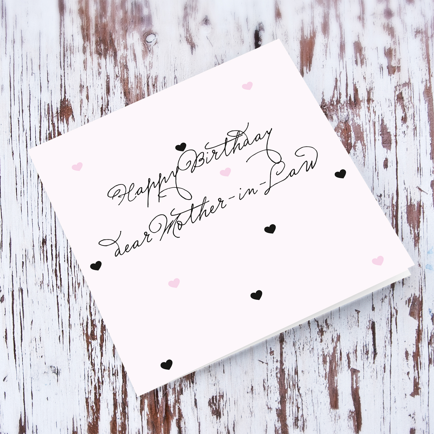 Light pink with scattered hearts birthday card for Mother-in-Law in English