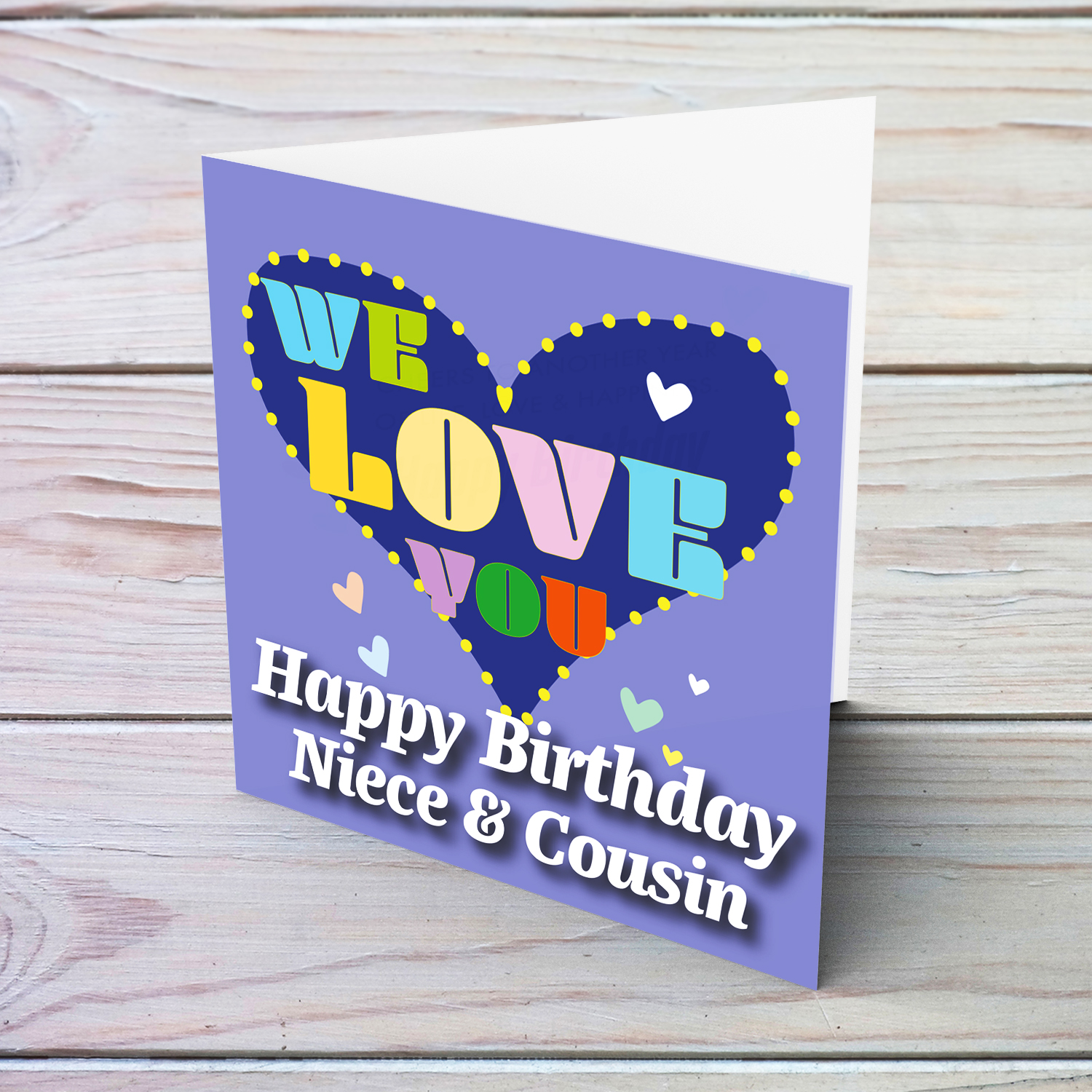 Purple background birthday card with big blue heart for Niece & Cousin, with a big WE LOVE YOU and scattered hearts in English