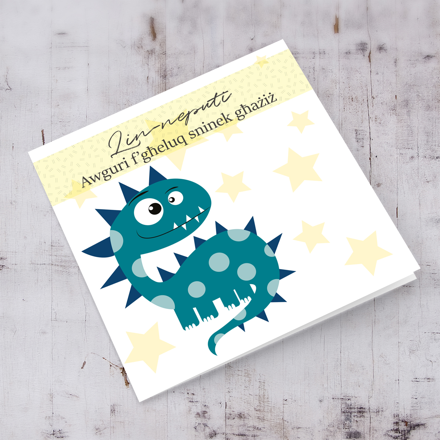 Dinosaur themed birthday card for nephew with pastel yellow stars in Maltese