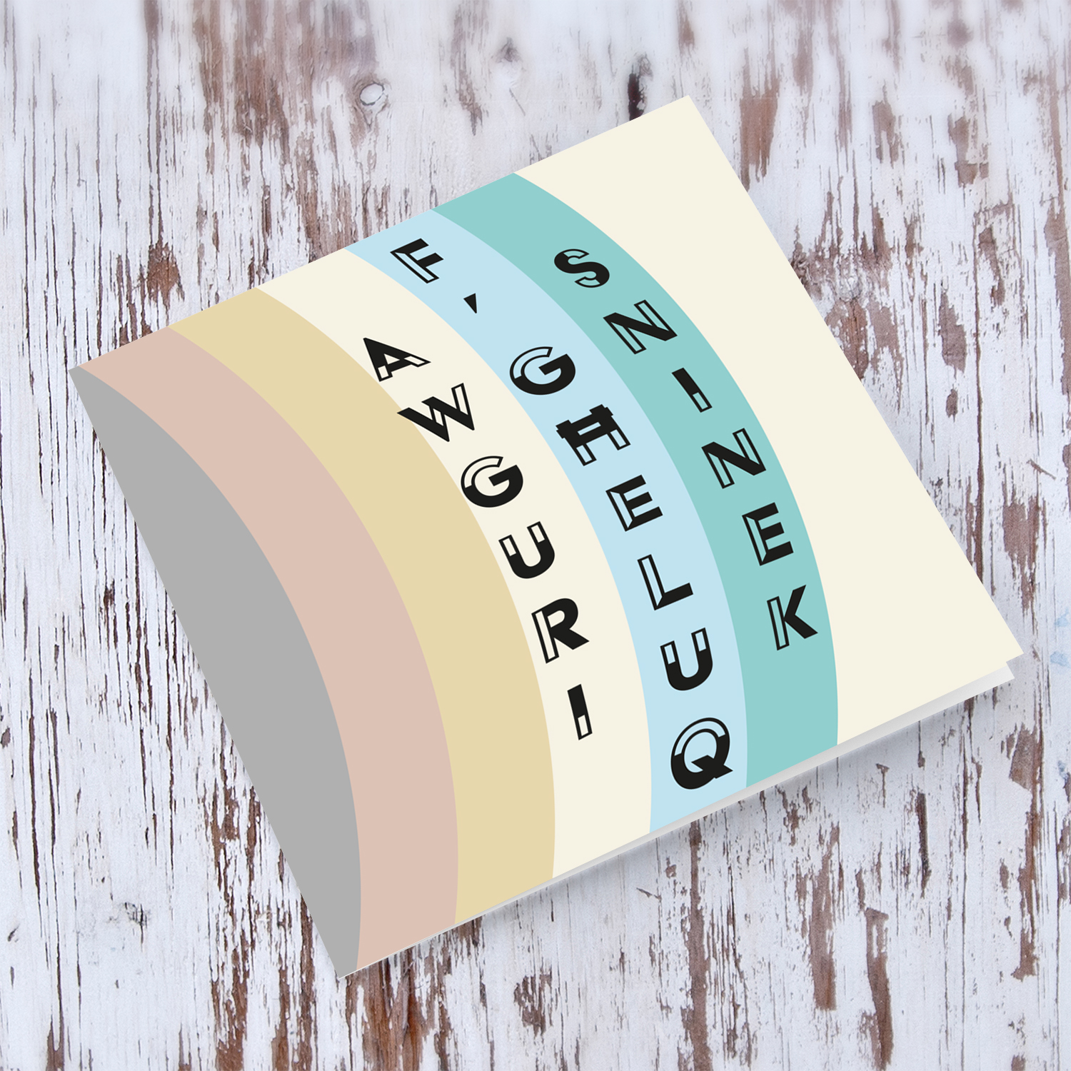 Various layers of pastel colours open birthday card in Maltese