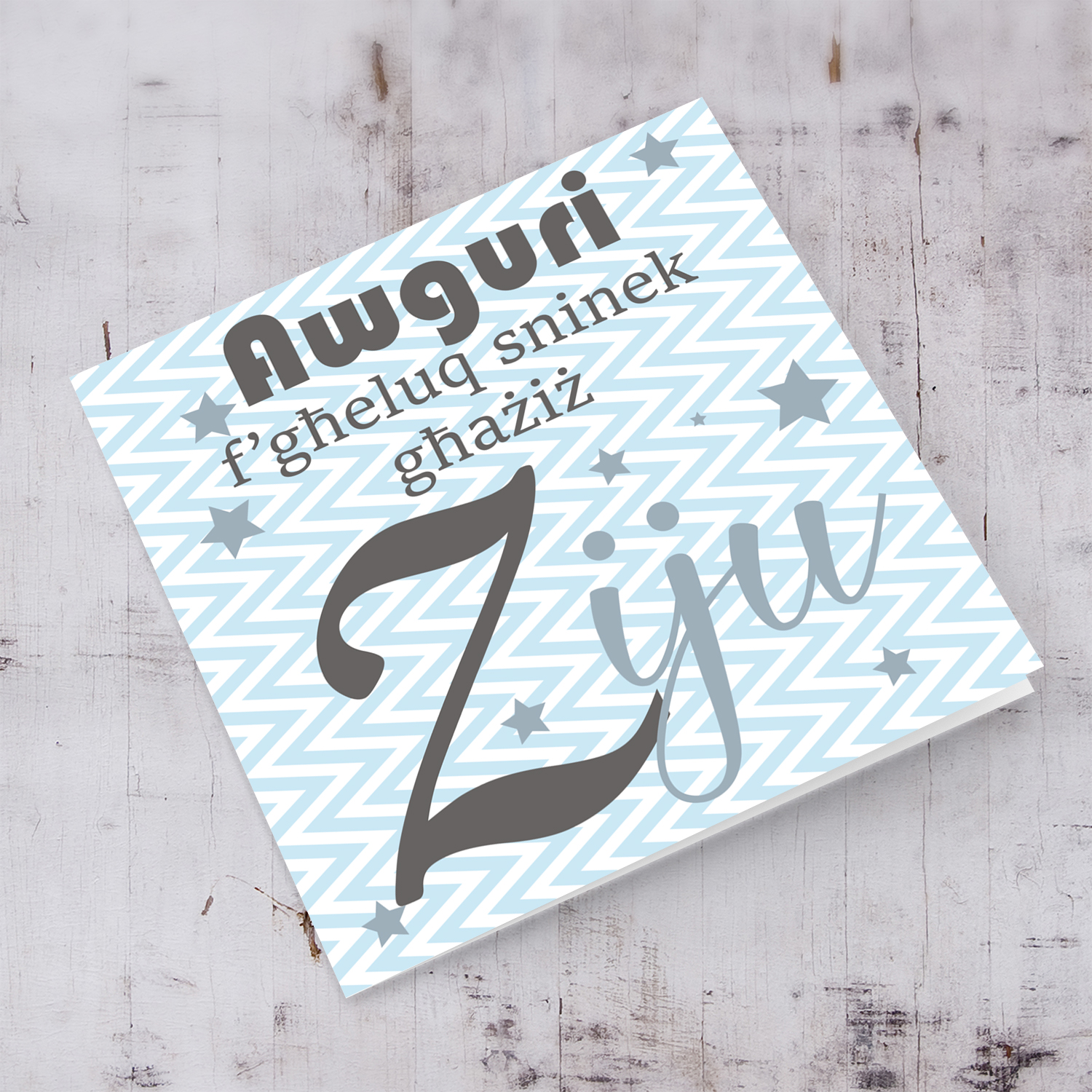 Blue with zigzag background and scattered stars birthday card for Uncle in Maltese