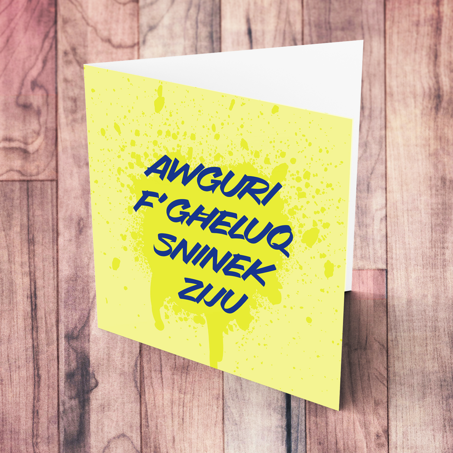 Yellow splattered paint background with blue text birthday card for uncle in Maltese