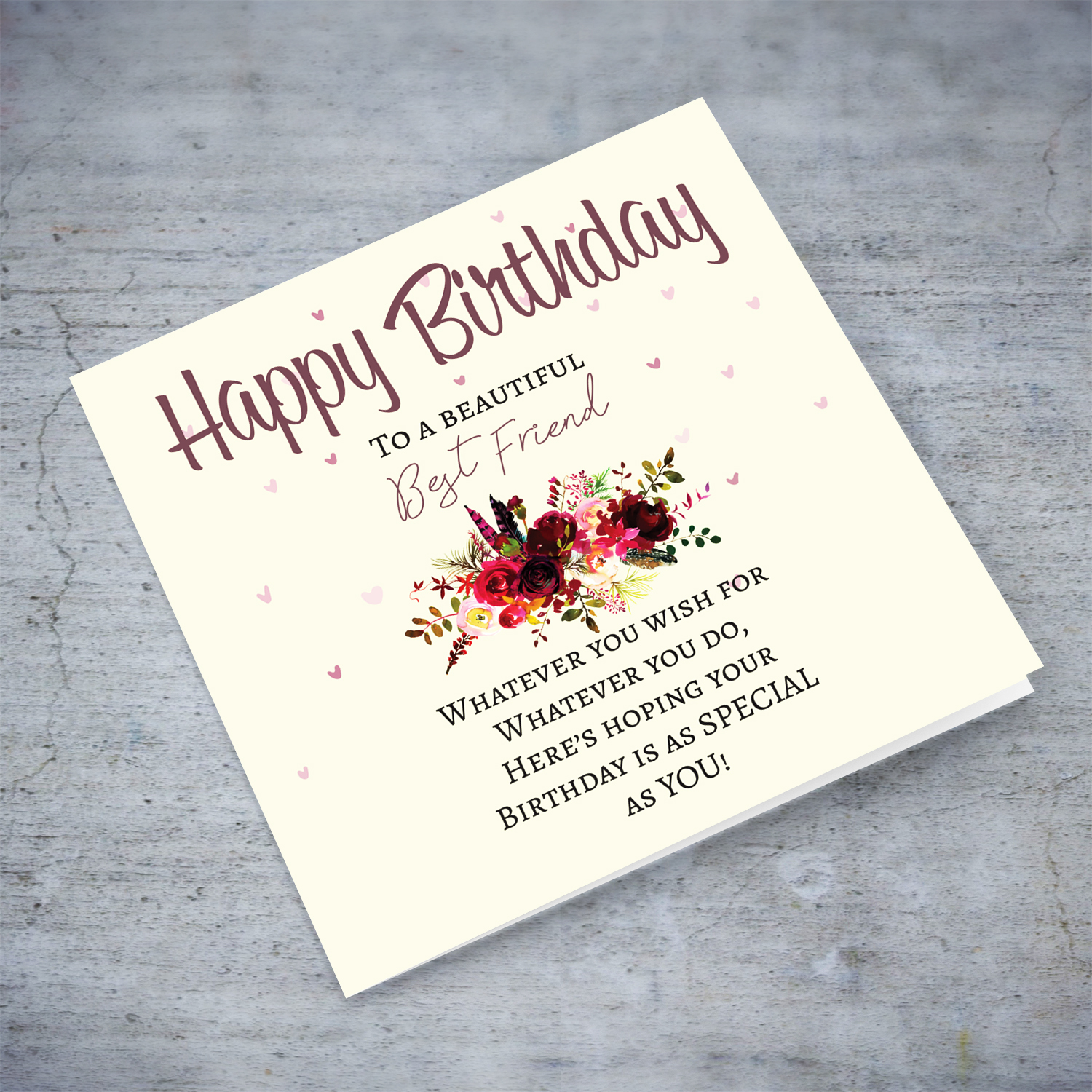 A birthday card with a special message with red tones colours and scattered hearts to a beautiful best friend in English