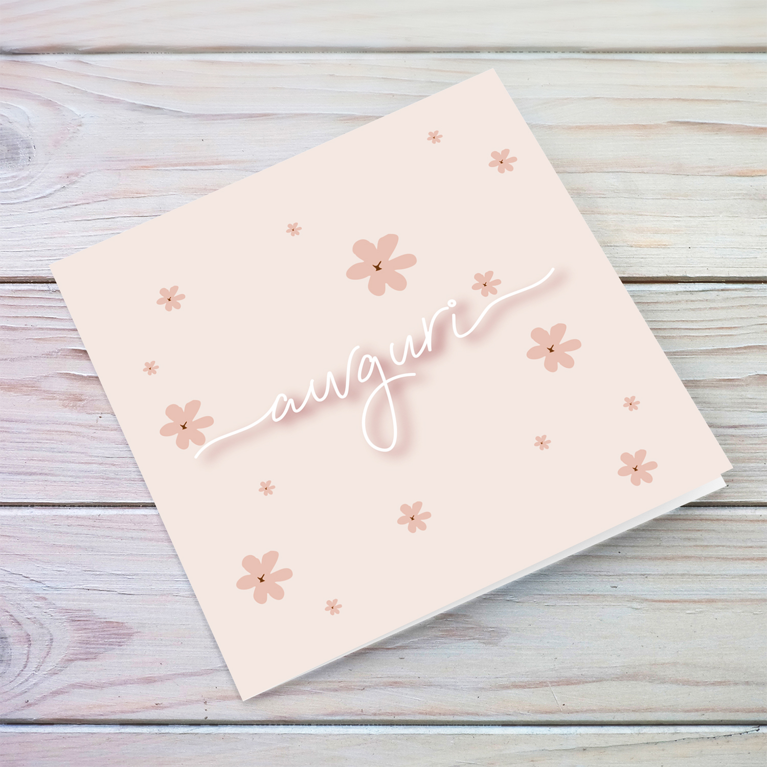 Pink background with petite scattered flowers and white text birthday card in Maltese