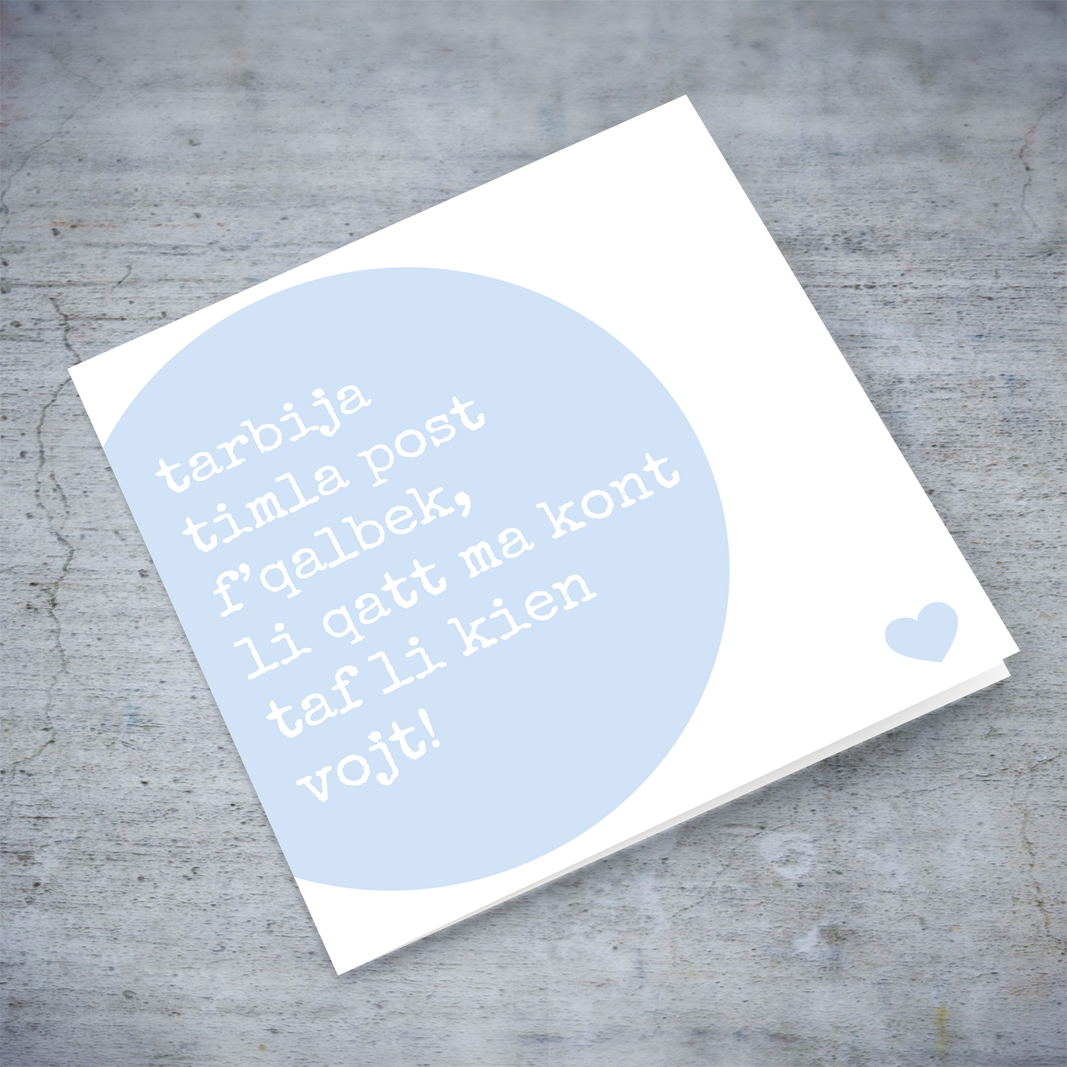 Blue circle baby shower card with blue heart in Maltese