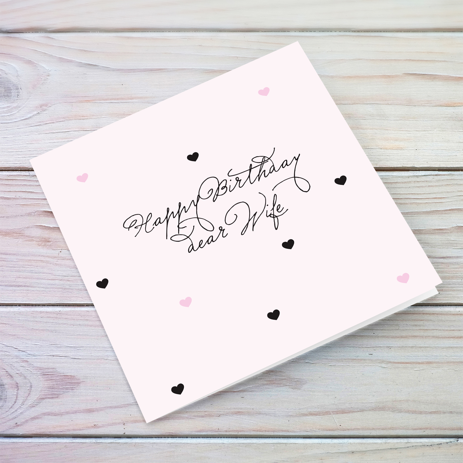 Light pink with scattered hearts birthday card for Wife in English