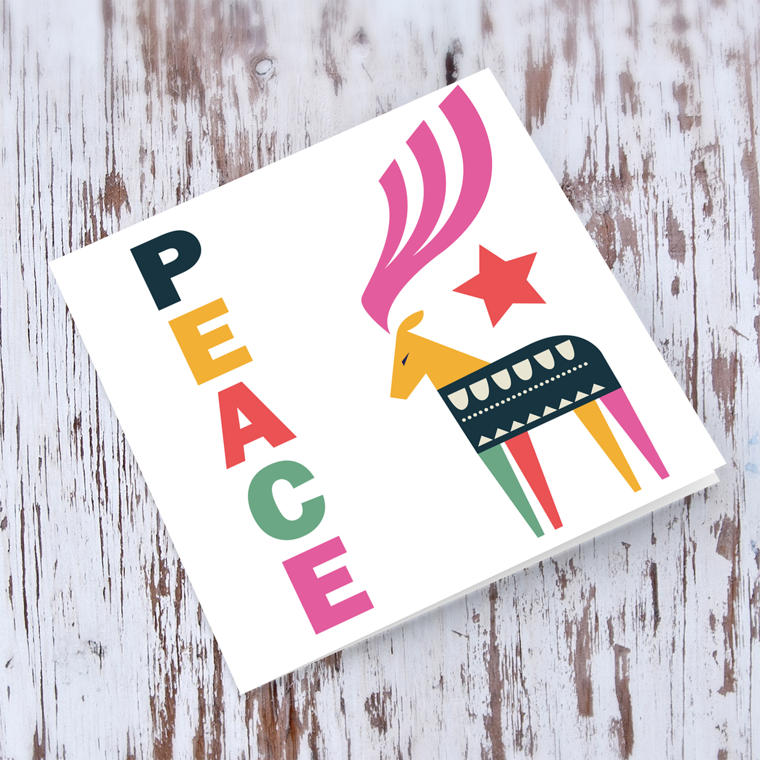 Reindeer themed Christmas card with the words PEACE in English