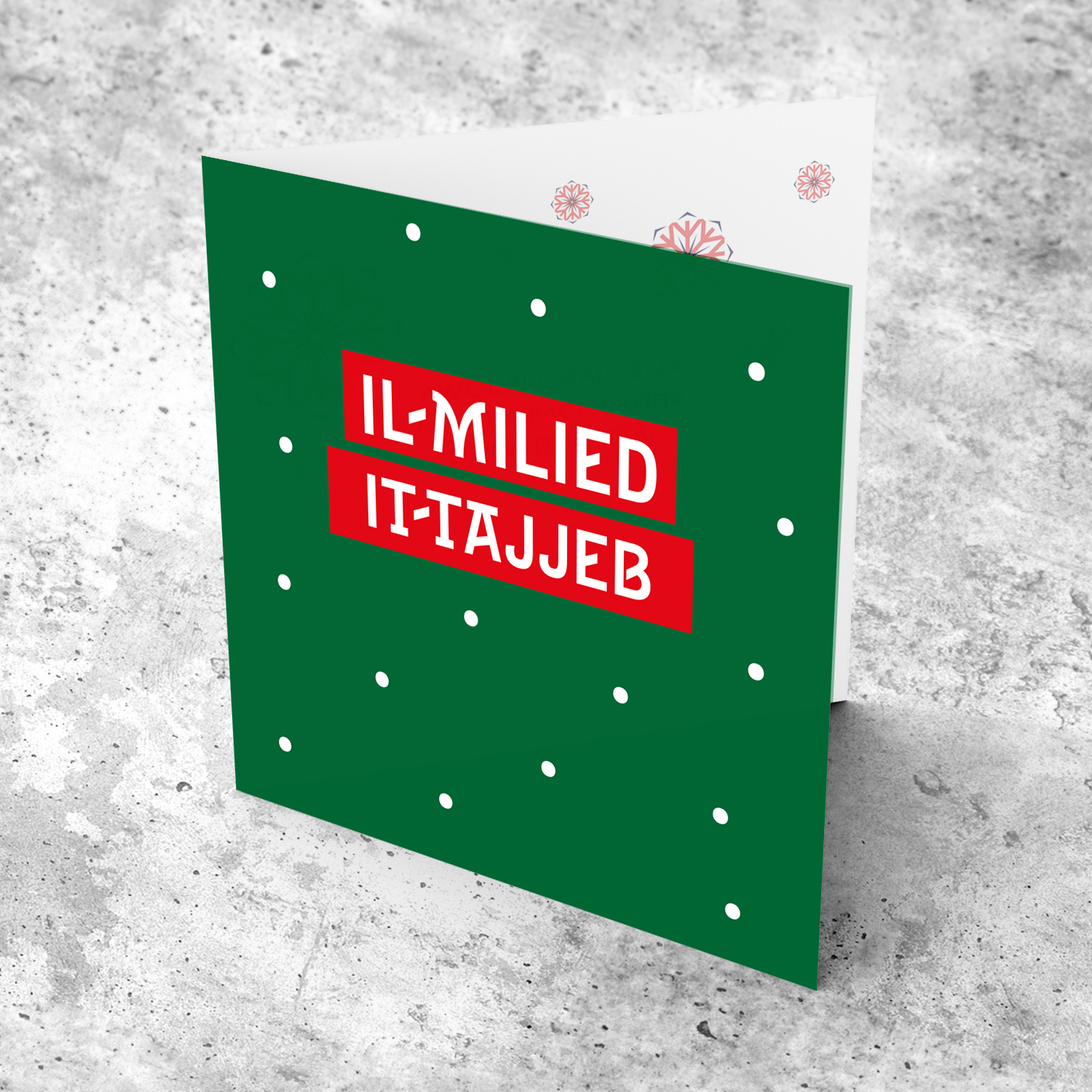 Green background with red rectangles and snow Christmas card in Maltese