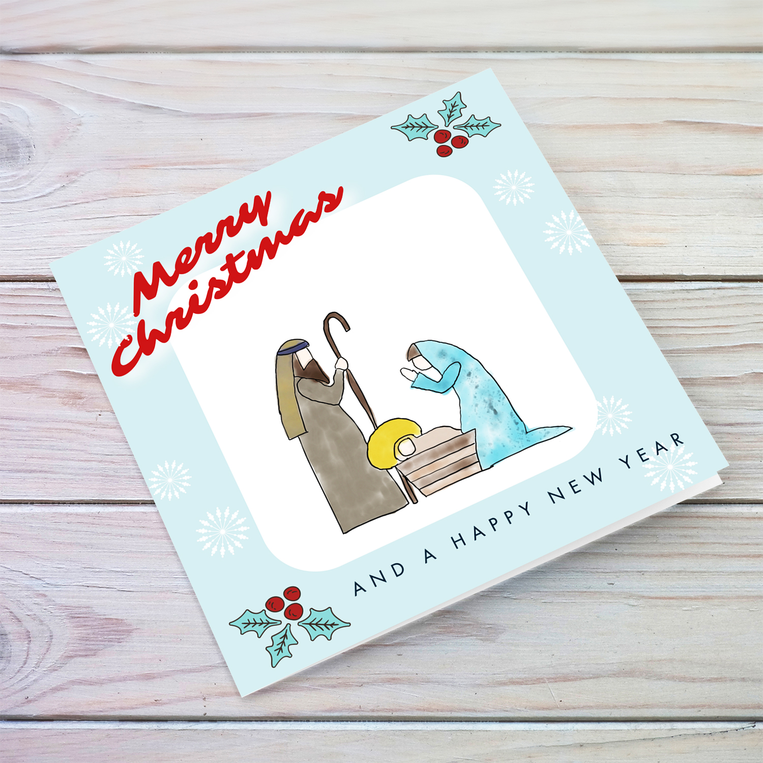 Nativity Themed Christmas card in light blue background, christmas hollies and snowflakes in English
