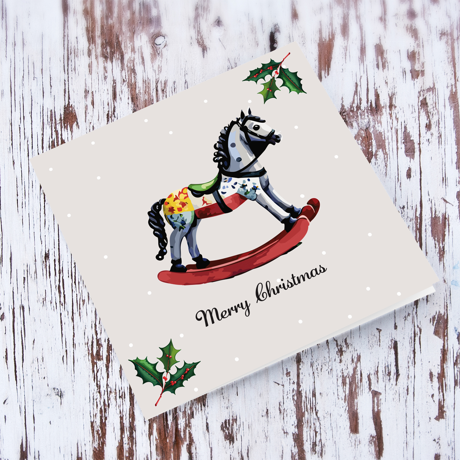 Cute rocking horse themed Christmas card with hollies in English