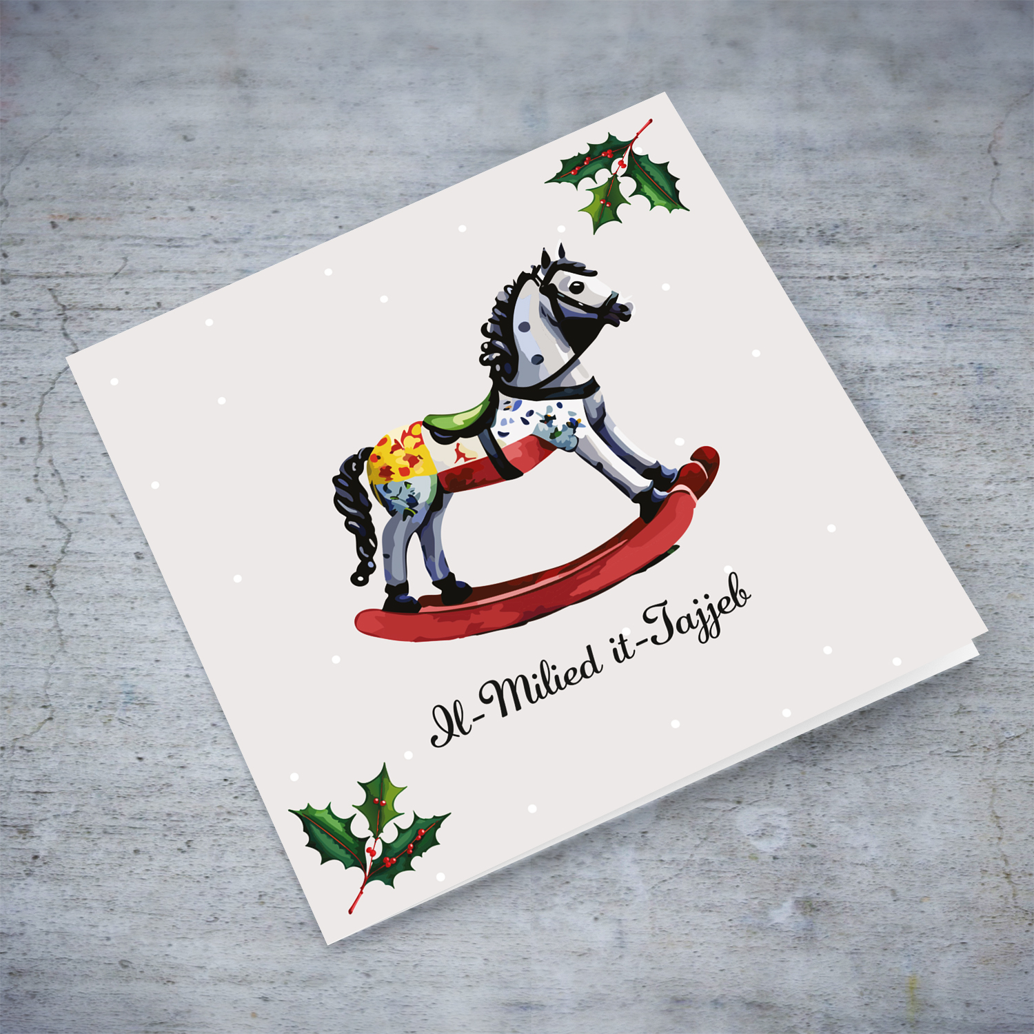 Cute rocking horse themed Christmas card with hollies in Maltese