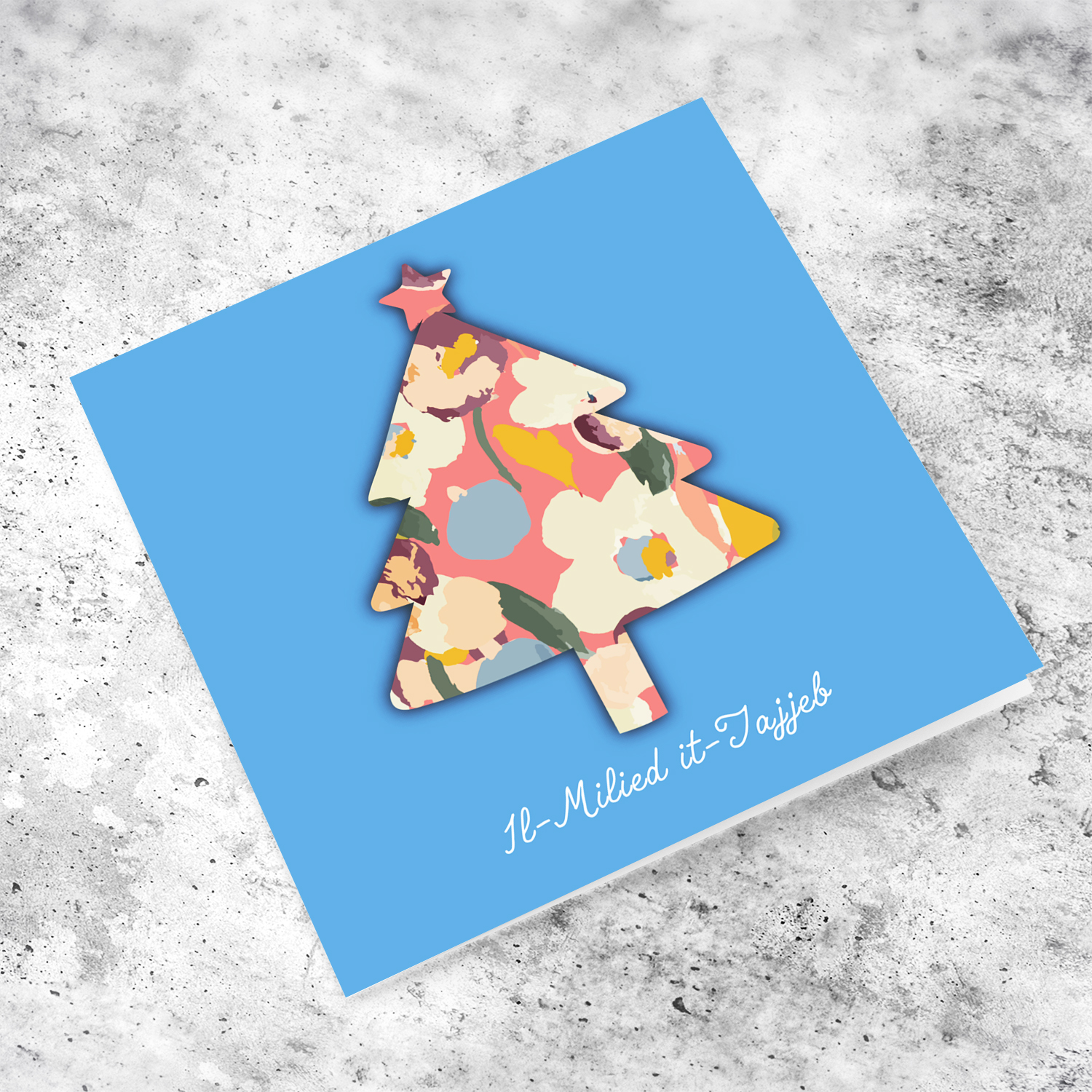 Pink flowery christmas tree shaped open card in blue background in Maltese  