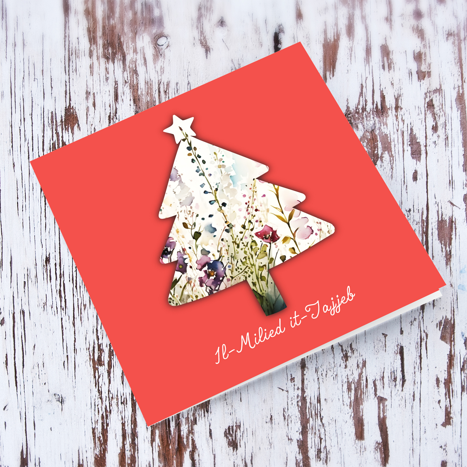 Coral coloured background with flowery christmas tree shaped open card in Maltese
