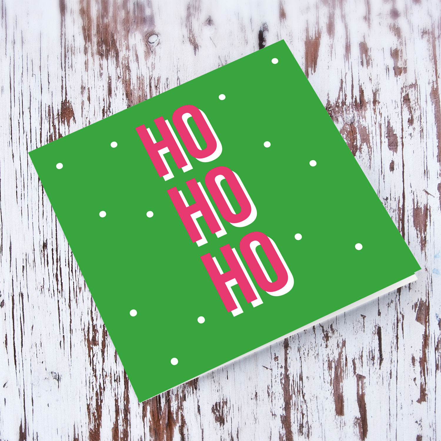 Ho ho ho christmas card in green background and pink text in English