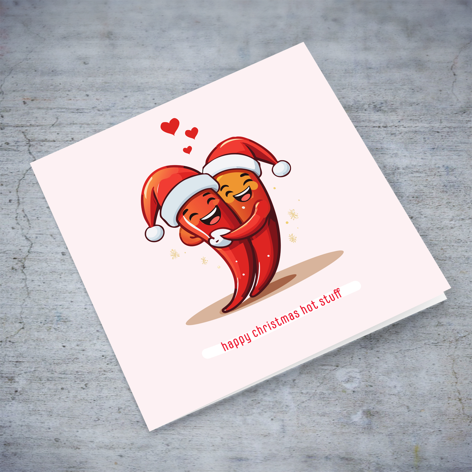 Happy Christmas hot stuff - cute & funny christmas card with two hugging chillies in light pink background in English