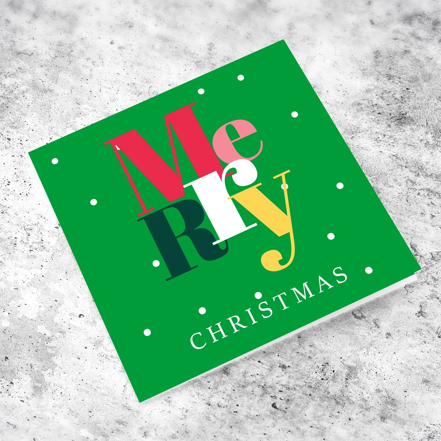 A cheerful open Christmas card with a festive green background and colourful text in English
