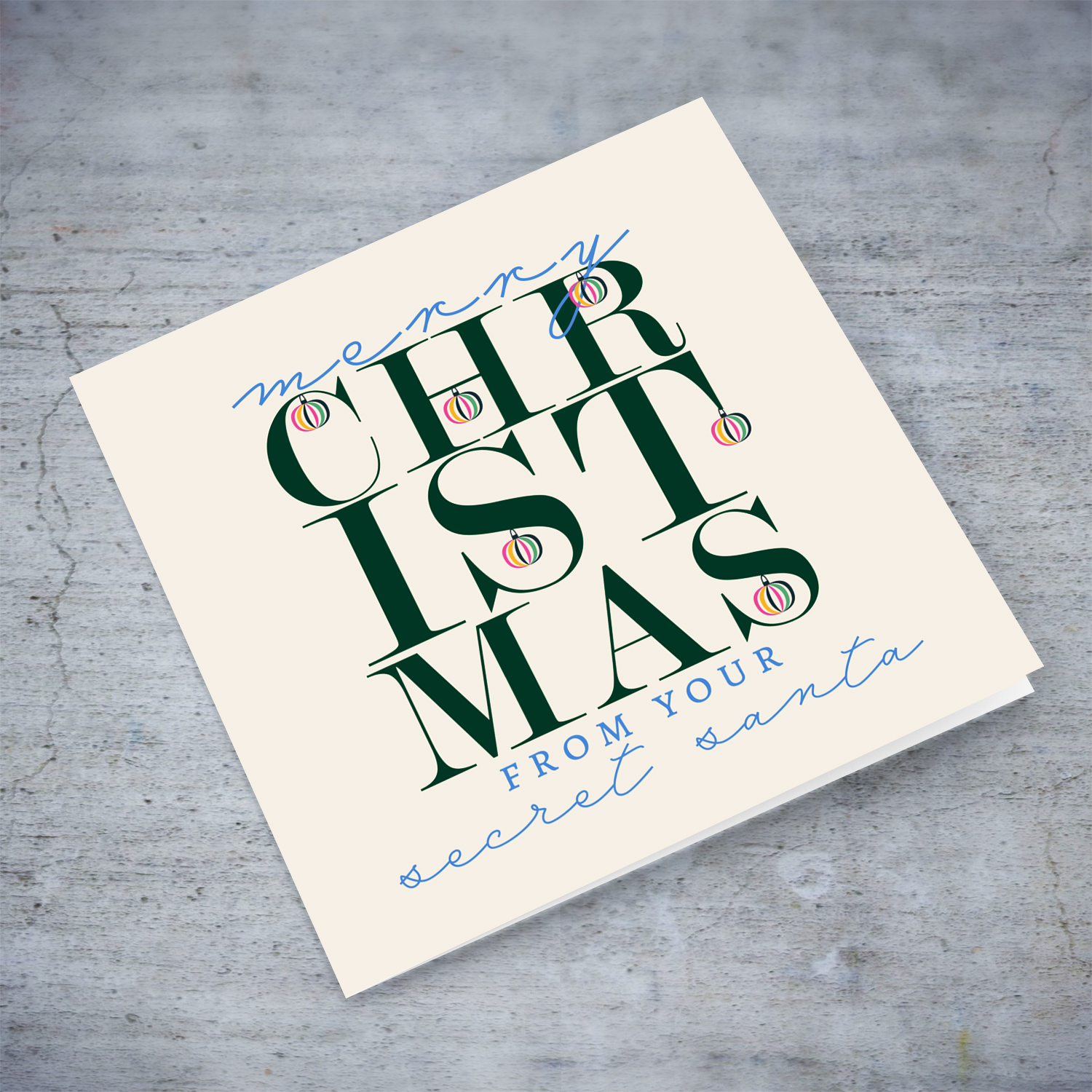 A beautiful, modern Christmas card, in the holiday's season colours and some pink with various hanging baubles - Secret Santa in English