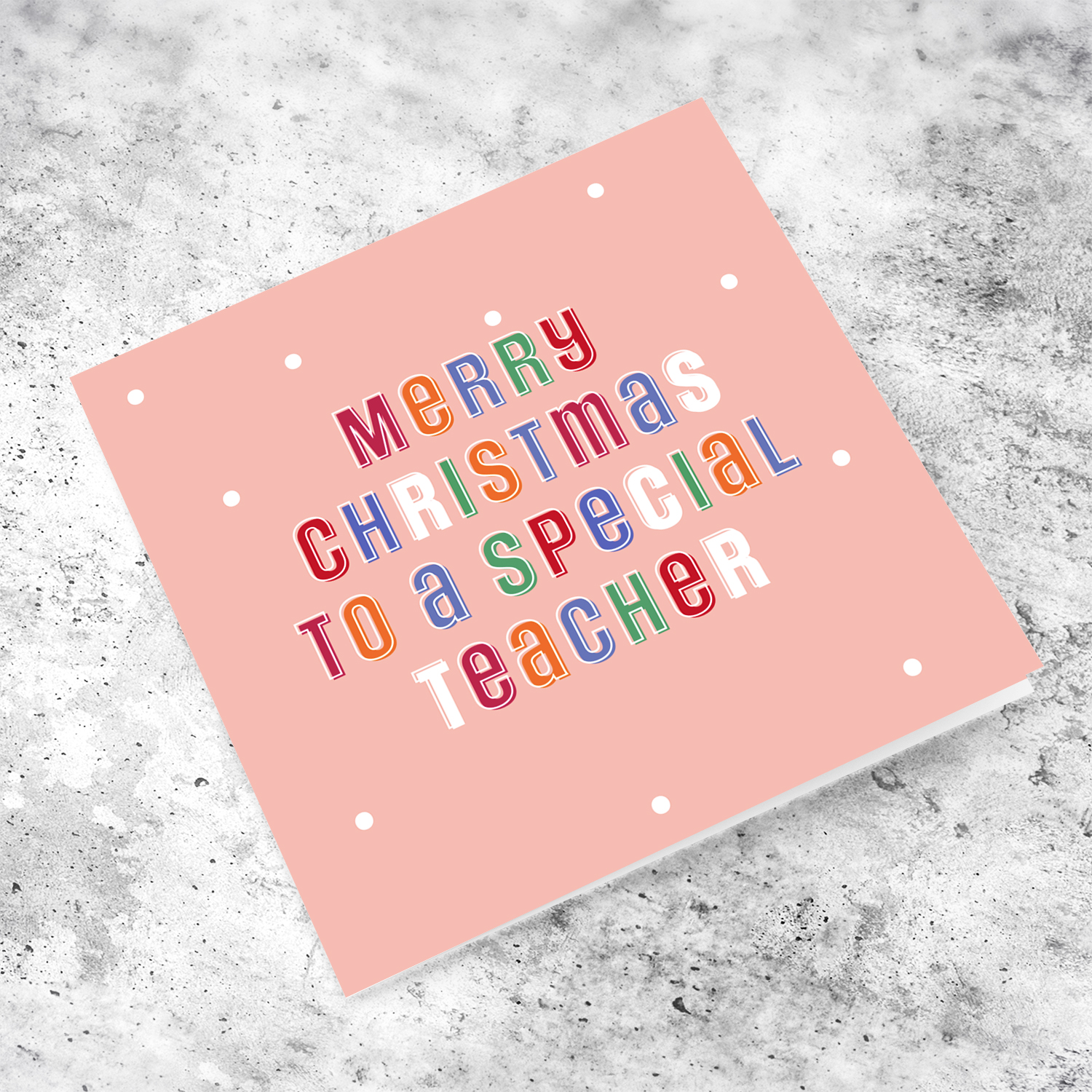 A cute Christmas card in a light pink background with colourful text for a special teacher in English
