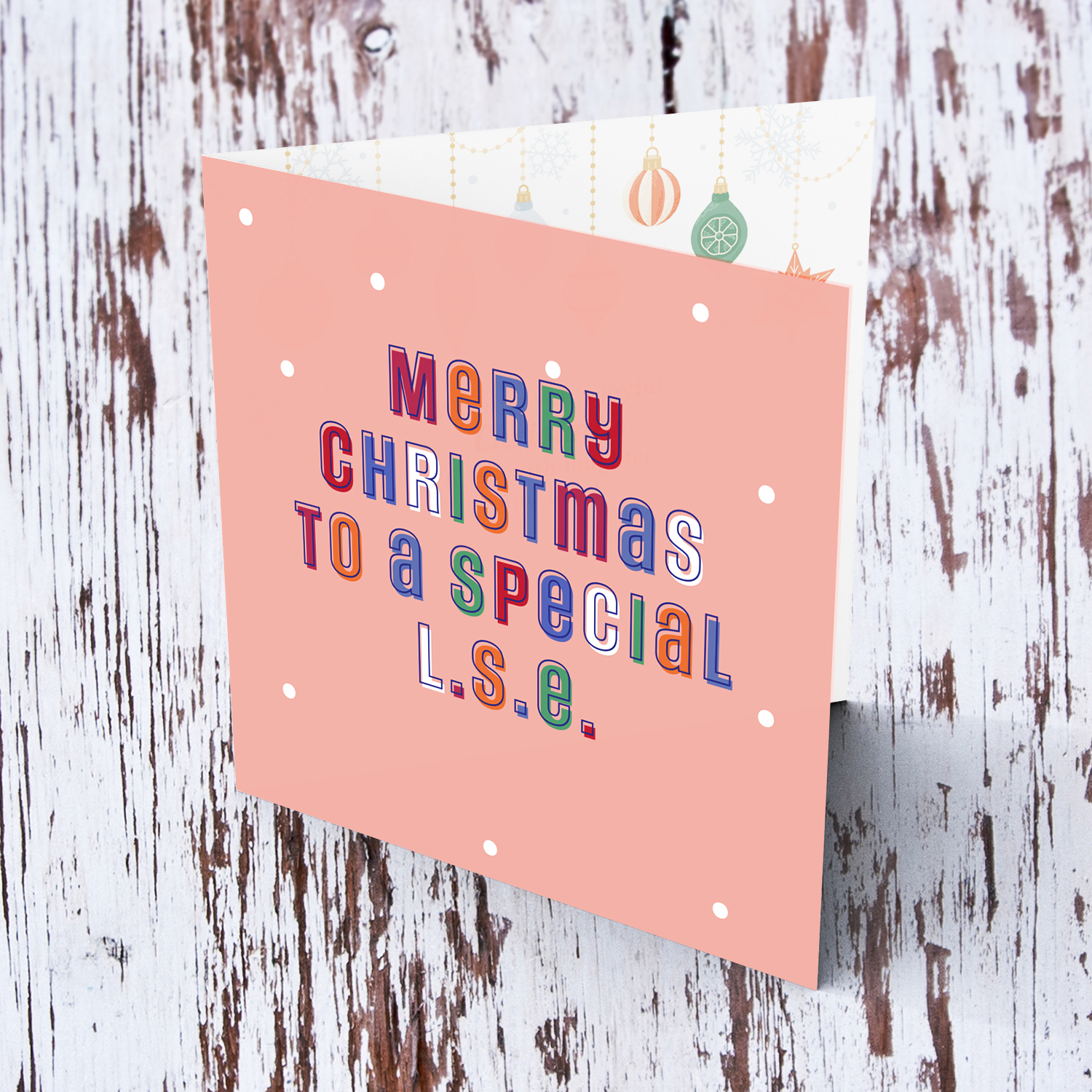 A cute Christmas card in a light pink background with colourful text for a special L.S.E. in English