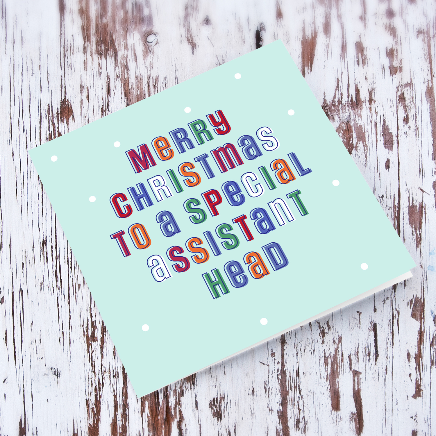 A cute Christmas card in a light blue background with colourful text for a special assistant head in English
