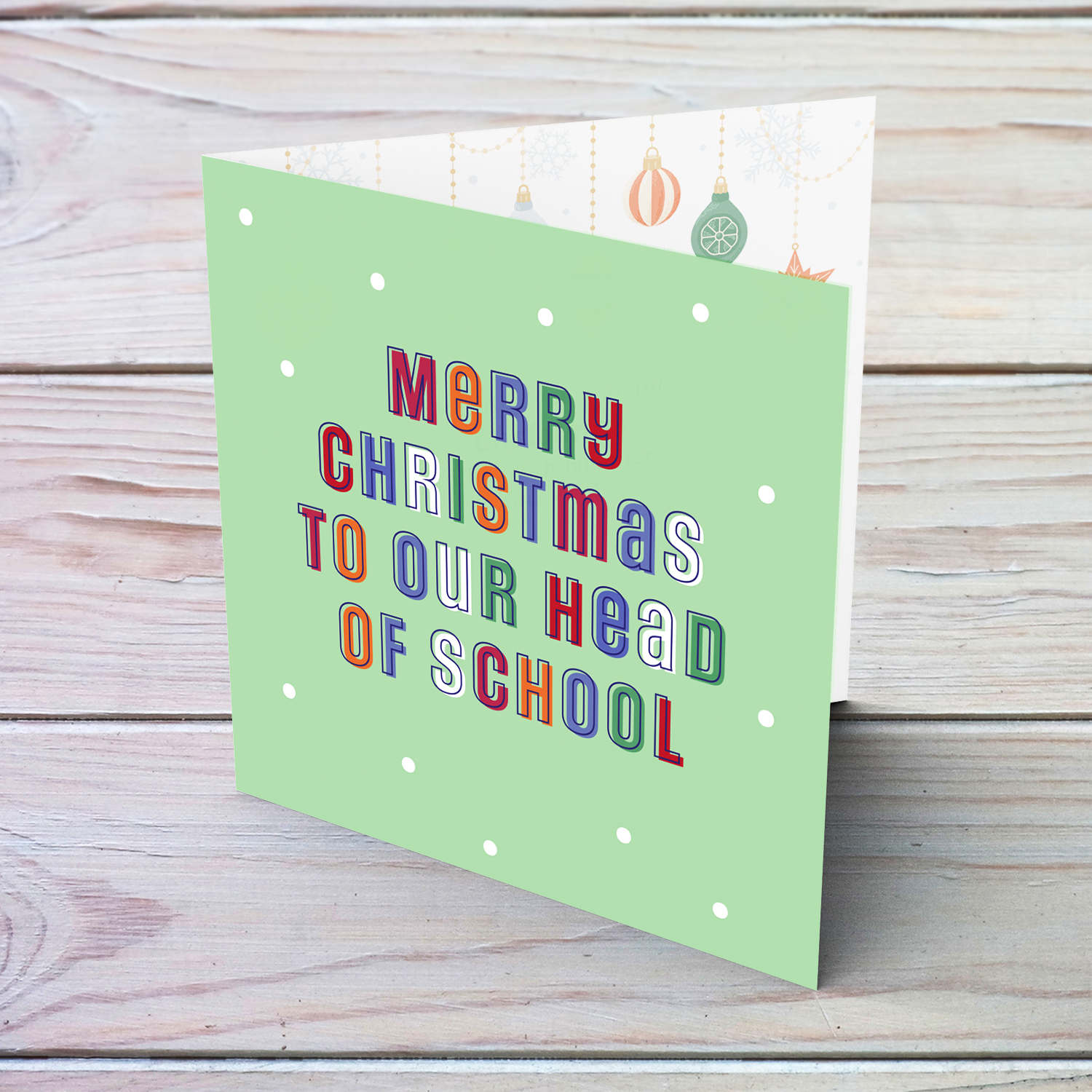 A cute Christmas card in a light green background with colourful text for Head of School in English (neutral & unisex)