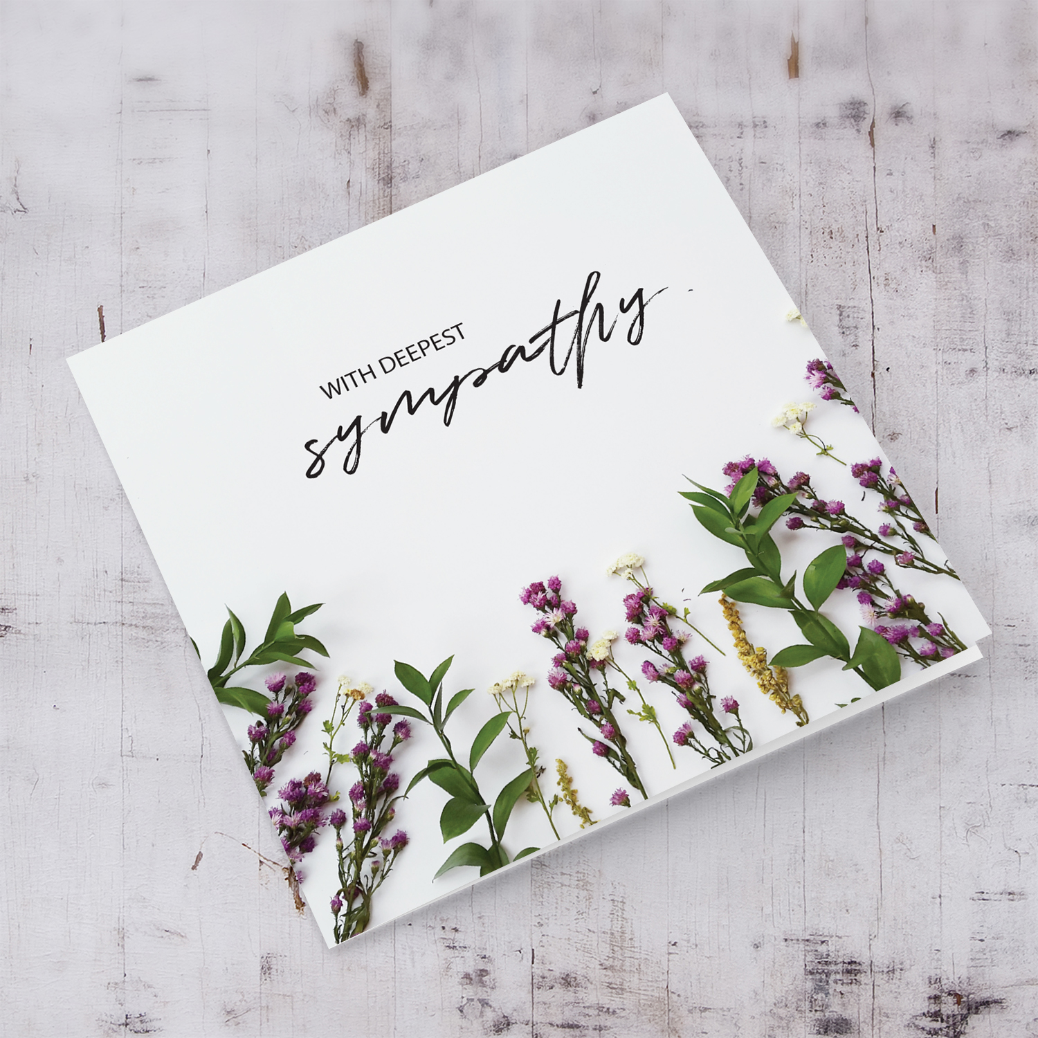 Sympathy card with foliage and flowers background in English
