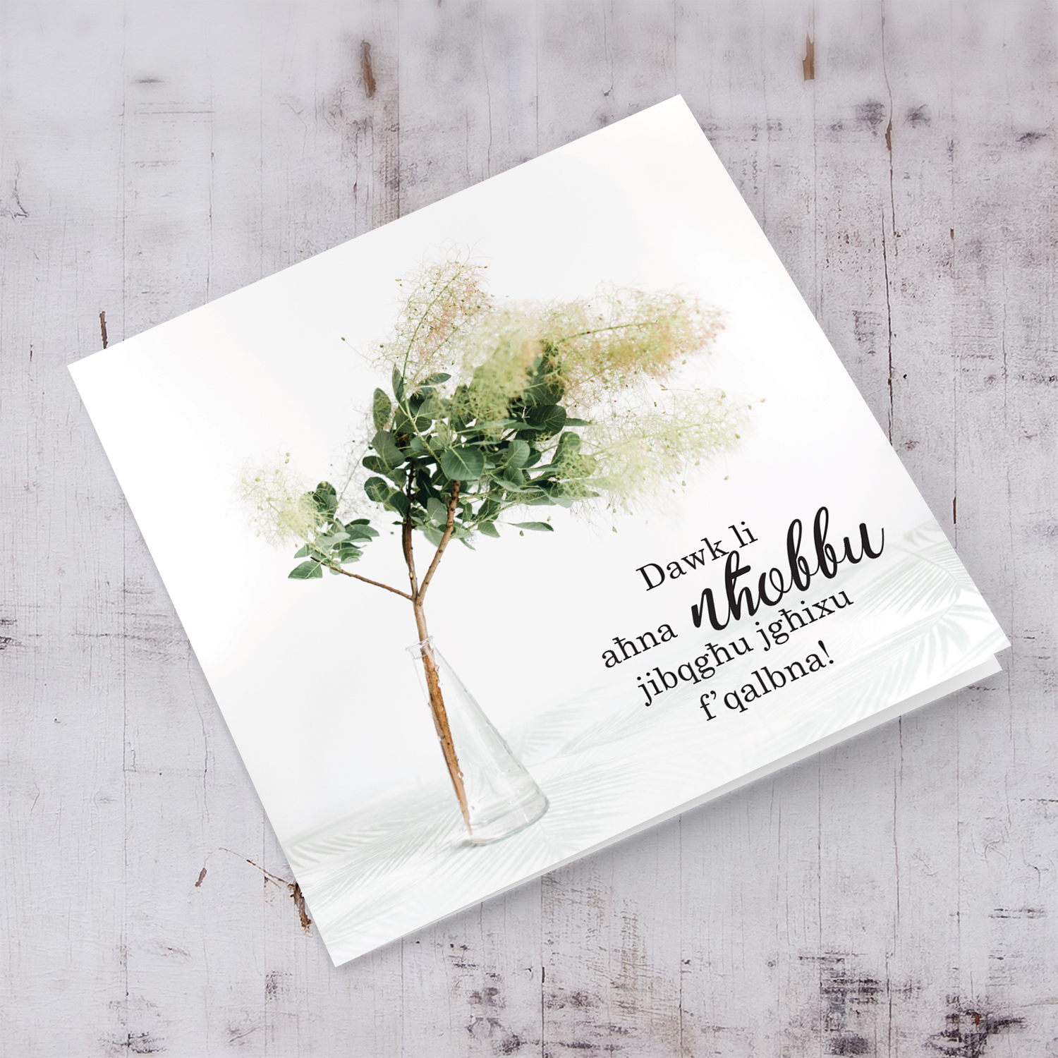 Sympathy card with flowers in vase in Maltese