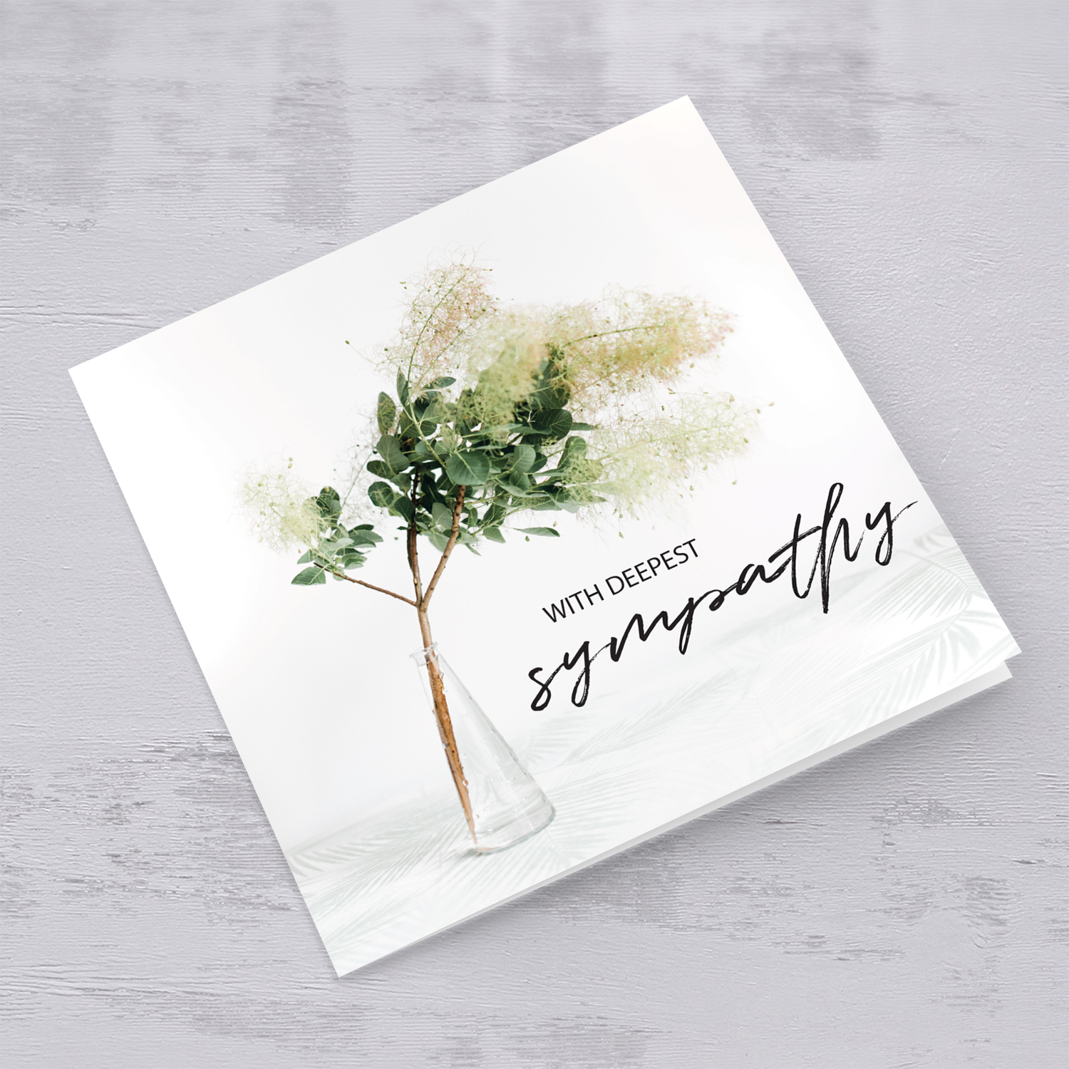 Sympathy card with flowers in vase in English