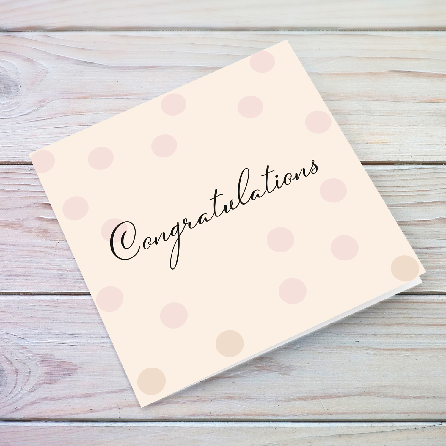 Open congratulations card with a light pink background and scattered dots in English (Blank message inside)