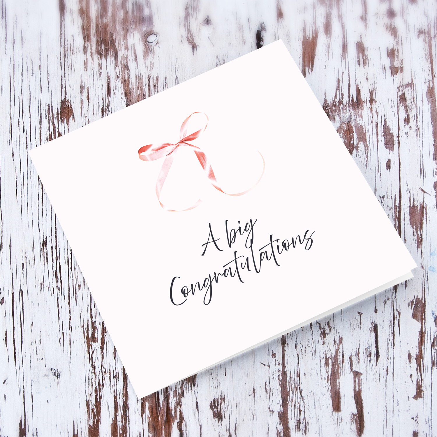 Minimalist and dainty open congratulations card with cute pink bow and light pink background in English