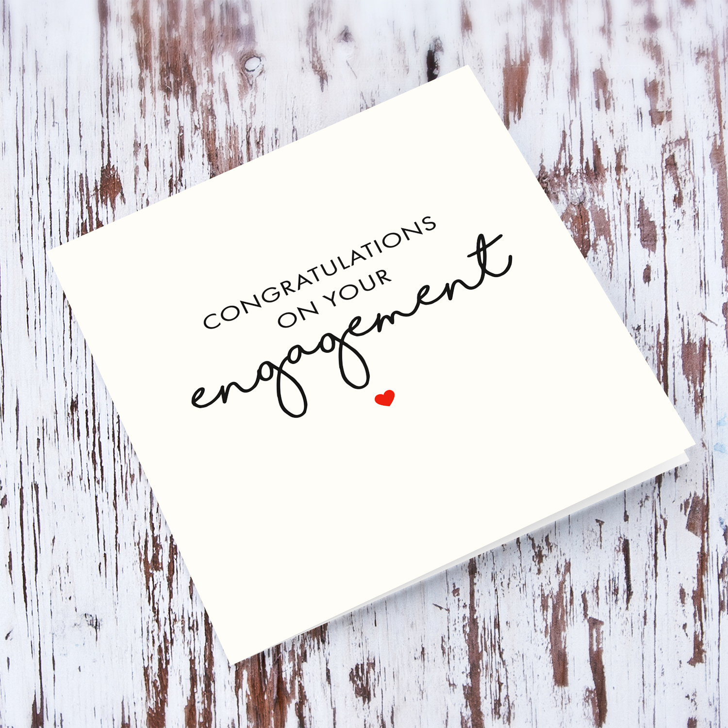 Minimalist Engagement card in black text and red heart in English