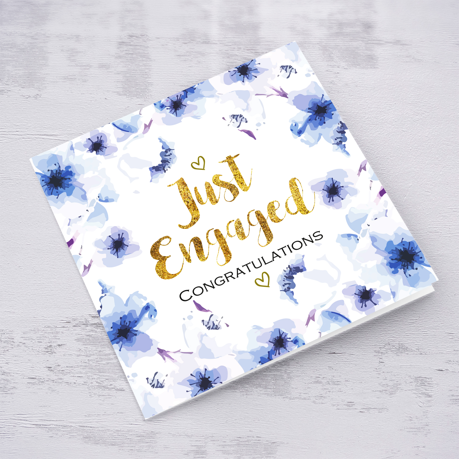 Blue flowers themed engagement card with golden text wedding card in English