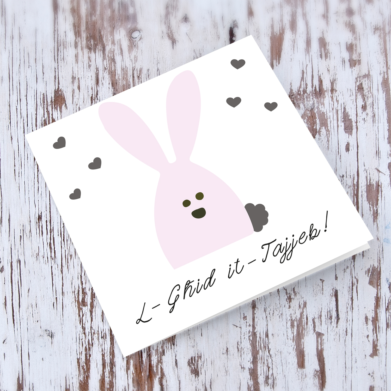 Pink rabbit themed Easter card with scattered hearts in Maltese