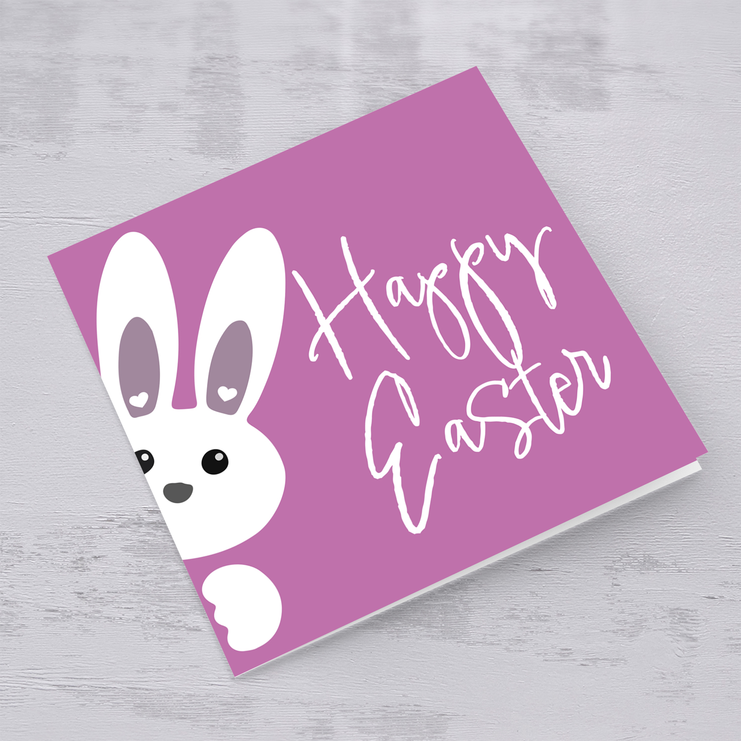 Cute bunny peeping out with pink/purple background Easter Card in English