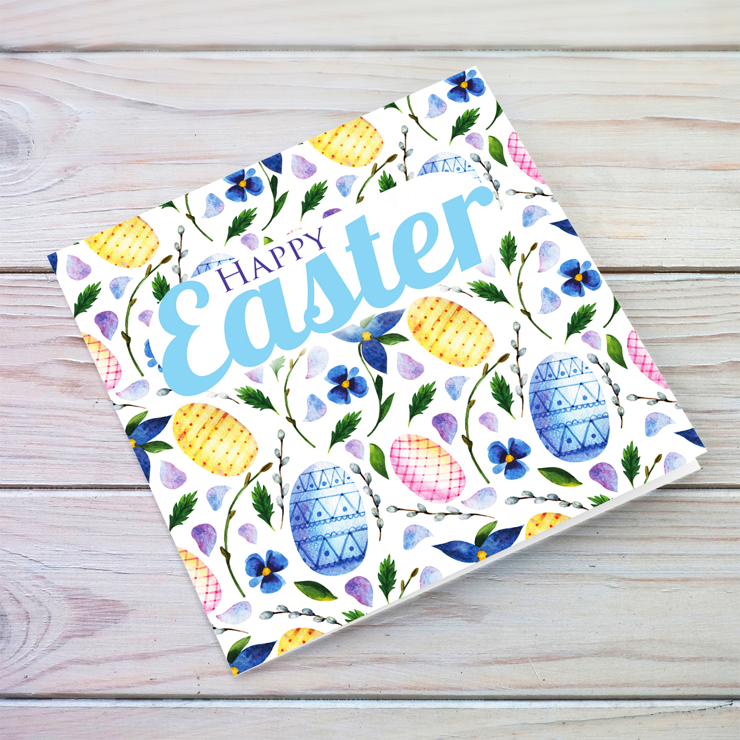Colourful Easter card in easter egg themed background in blue tones - English