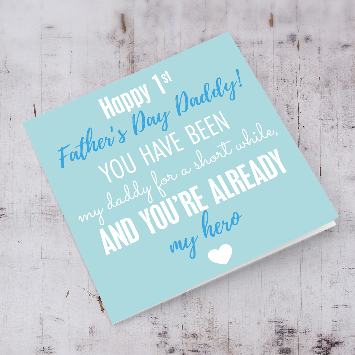 First Father's Day card in pastel green background and dark blue and white wording.