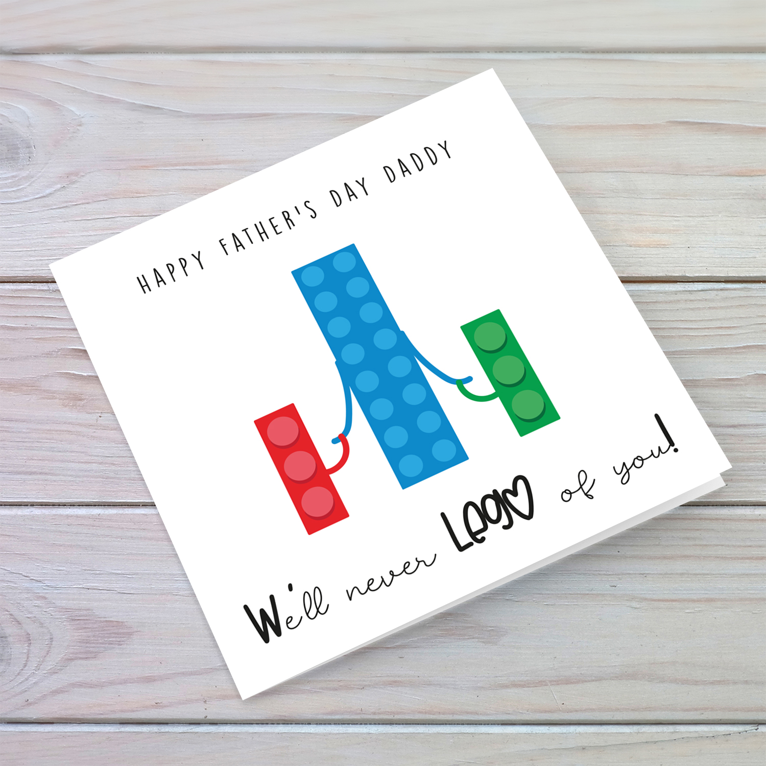 Lego themed father's day card in blue and green - We'll never LEGO of you! in English (plural)