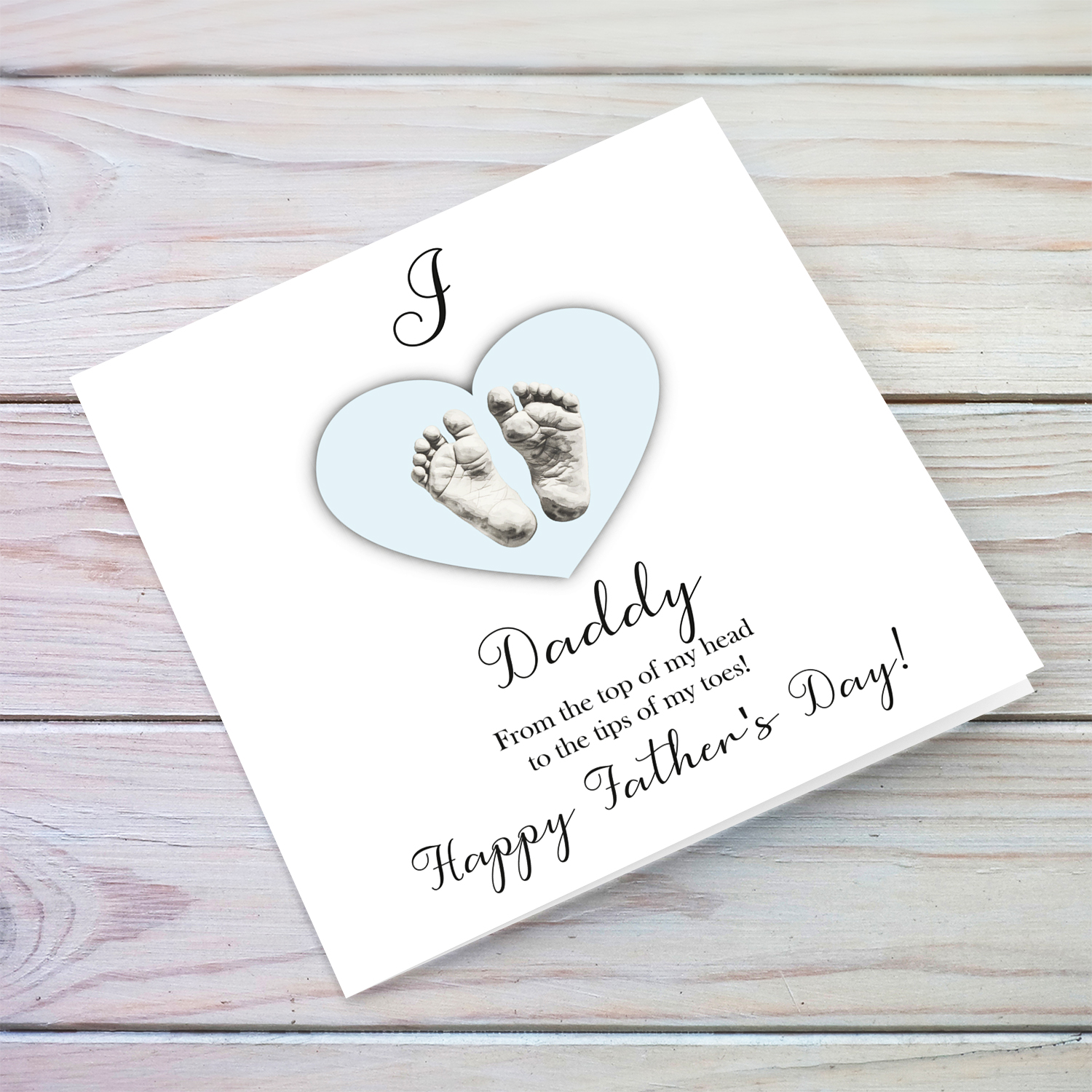 A cute baby footprint father's day card for daddy, I love daddy, in a light blue heart in English