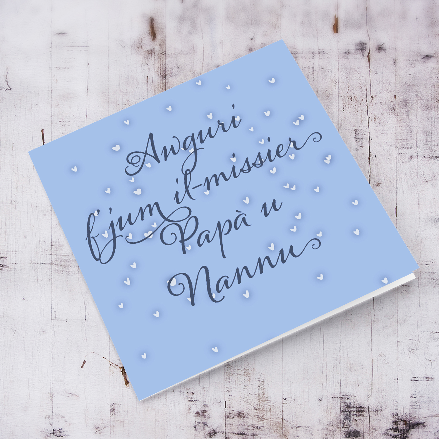 Father's day card in blue background with scattered hearts for dad and grandad in Maltese
