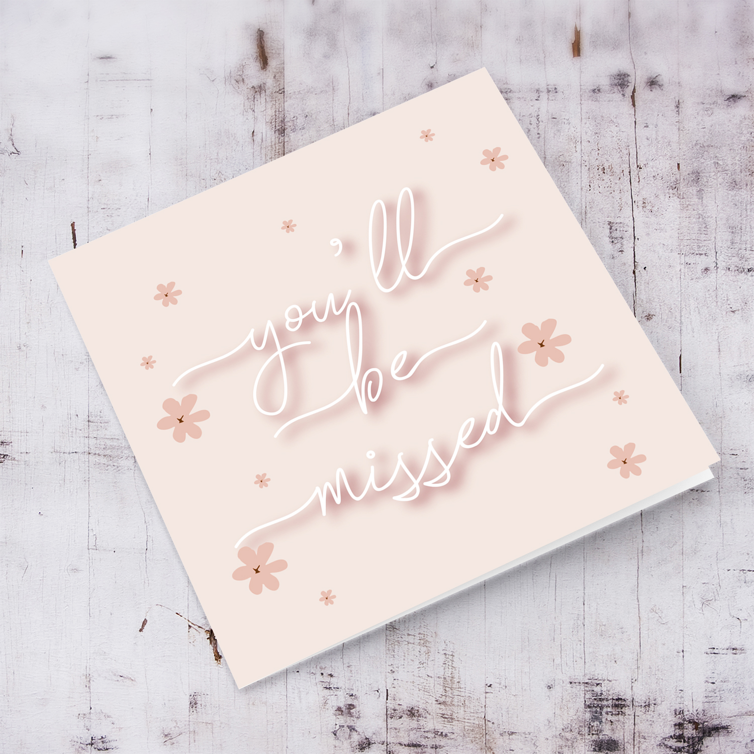 Pink background with petite scattered flowers and white text farewell and good luck card in English