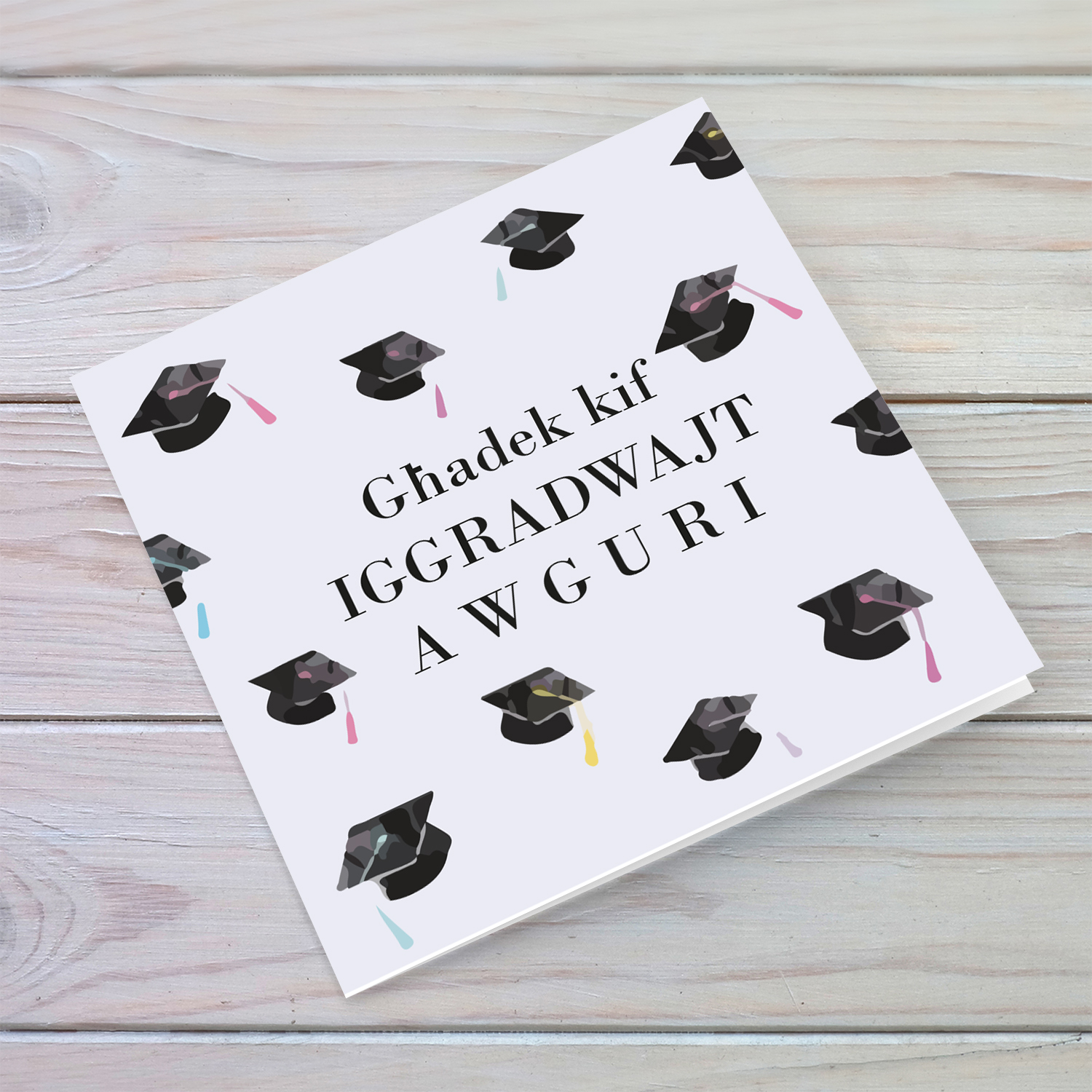 Graduation card with scattered party hats in Maltese