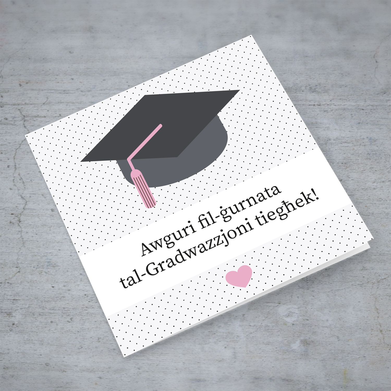 Graduation card with dotted background and pink heart in Maltese