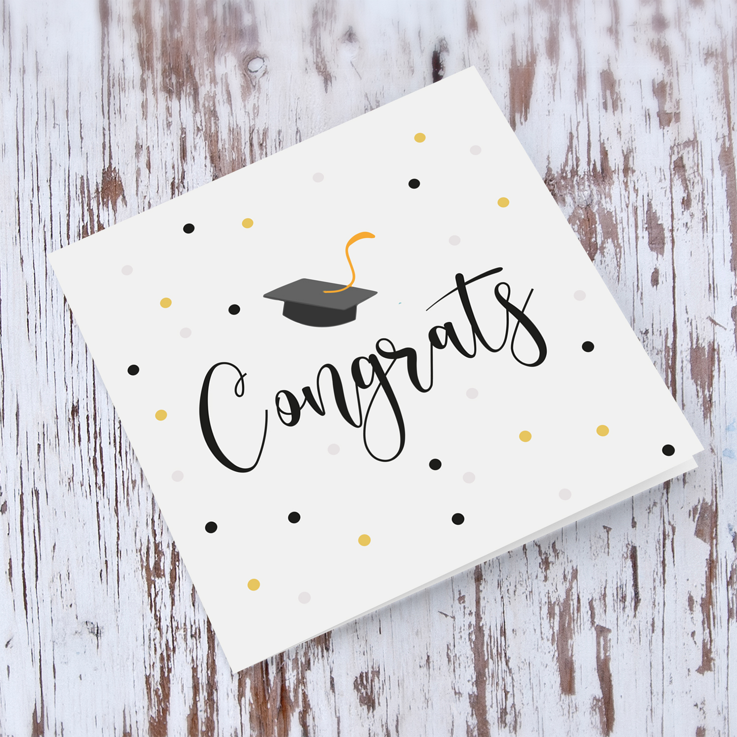 Congratulations card with scattered dots and graduation hat in English (unisex)